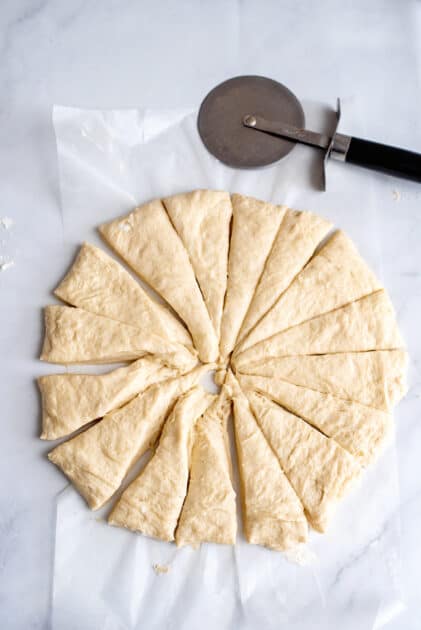 Cut yeast roll dough with a pizza cutter.