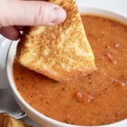 Dipping Grilled cheese into tomato soup