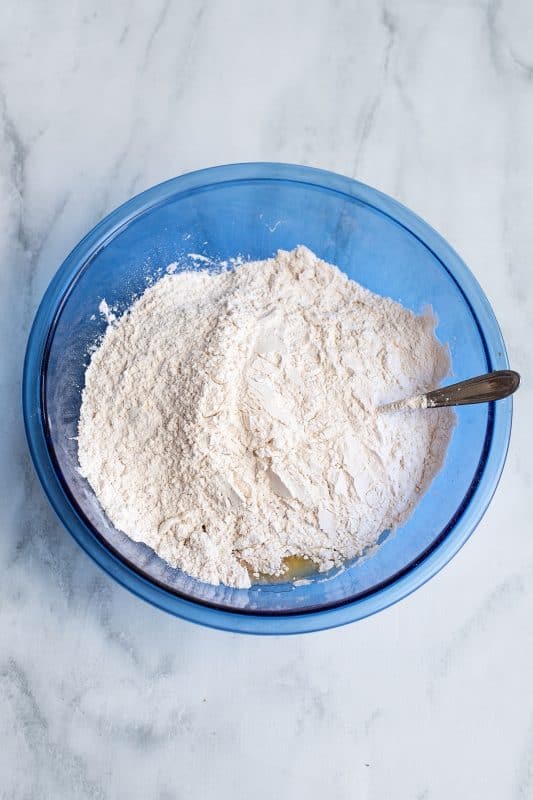 Add the remaining flour to the mixing bowl.