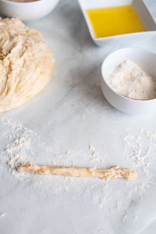 Take a small amount of dough and make a twist.