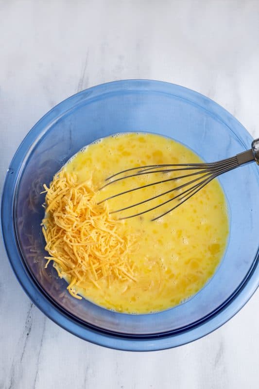 Add cheese to mixing bowl.