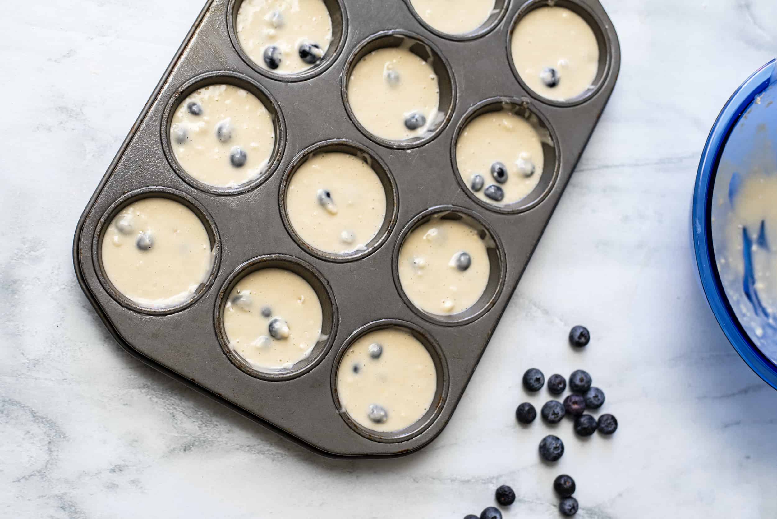 Pour muffin batter into prepared muffin pan and bake.