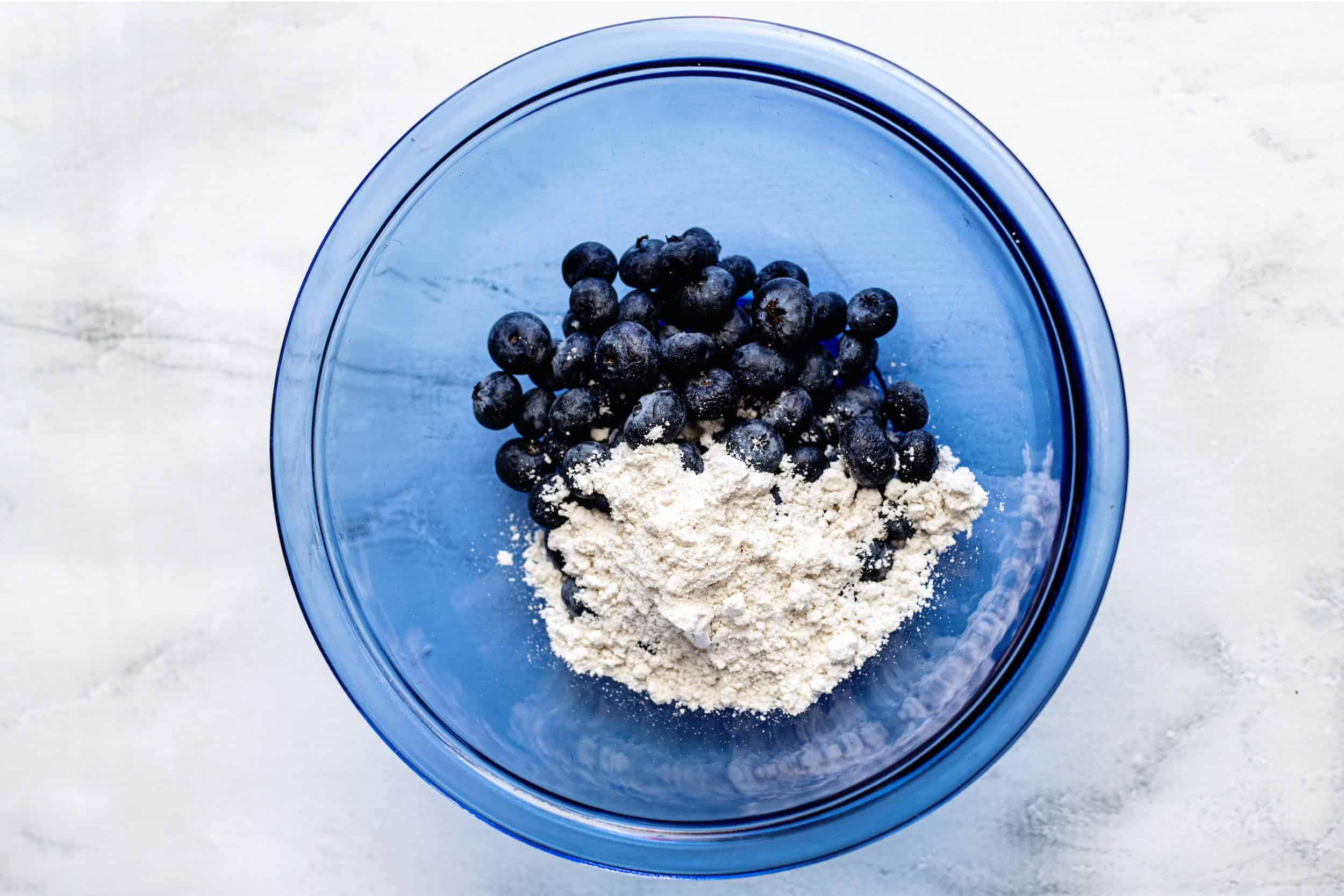 Place blueberries and 1/4 baking mix in small bowl.