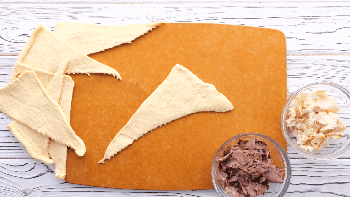 Separate crescent roll dough into triangles.