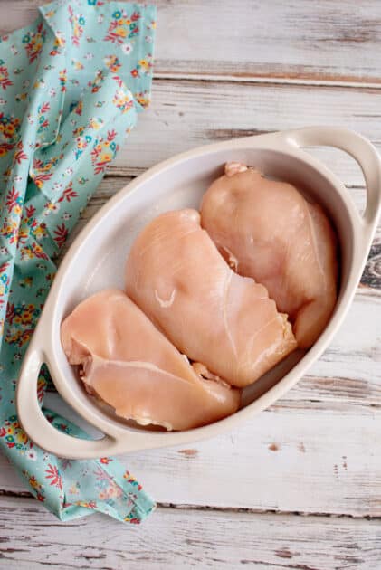 Place chicken breasts in baking dish.