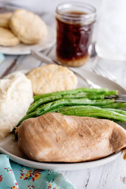Marinated chicken breast with green beans and mashed potato. All purpose marinade in background.