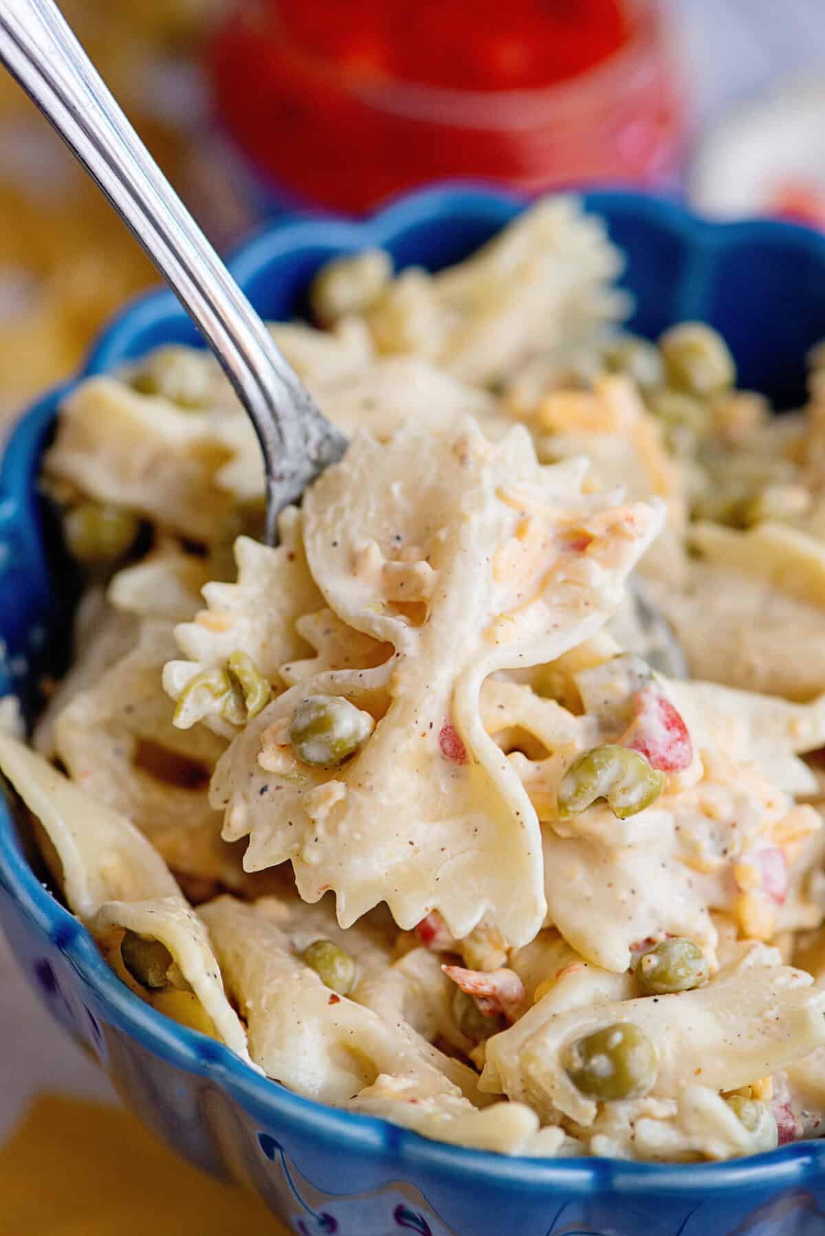 Close-up of a spoon holding Velveeta bowtie pasta.