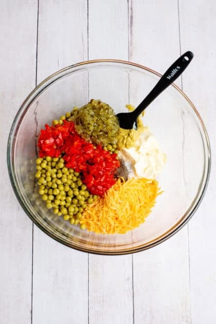 Dressing ingredients in a glass mixing bowl.