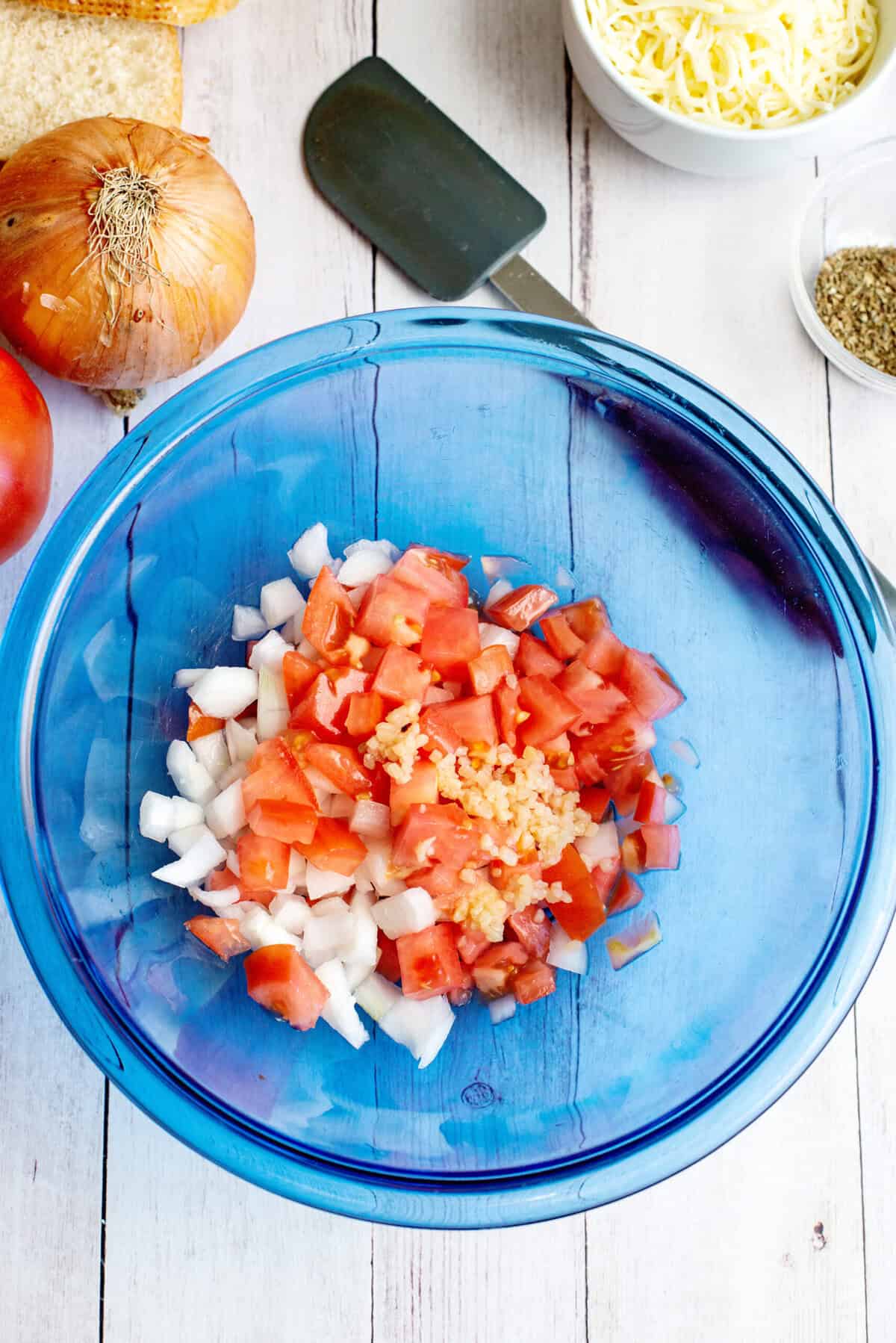 onion, tomato, and garlic in a bowl