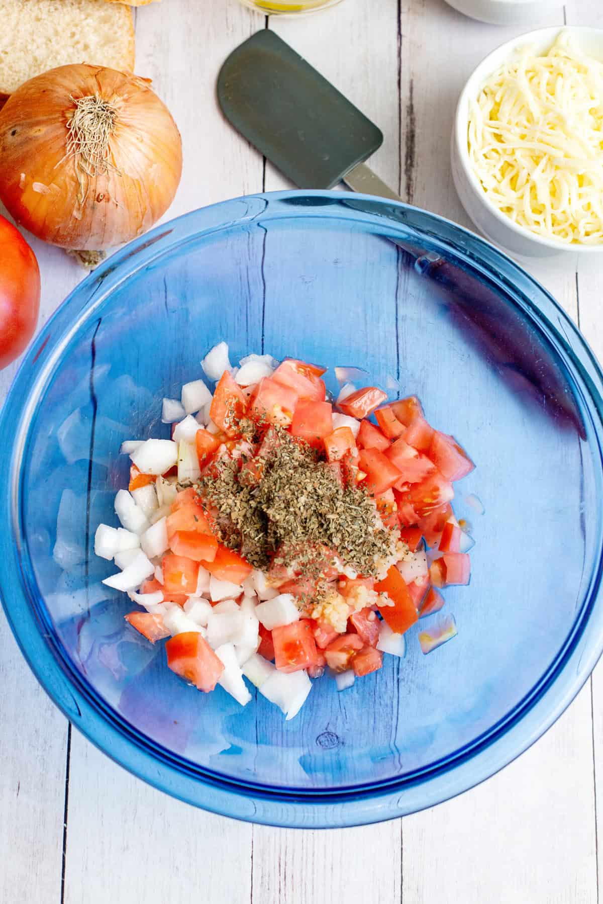 add basil to the tomato and onion mixture