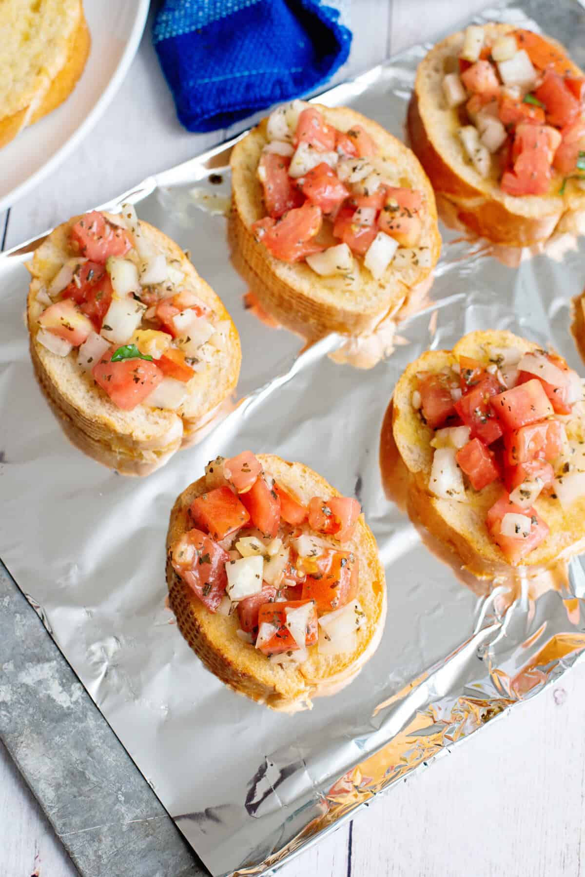put tomato mixture on top of the bread