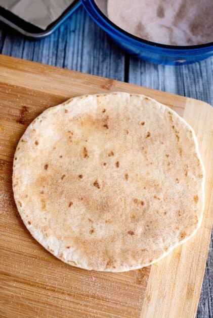 Sprinkle cinnamon and sugar over tortilla.