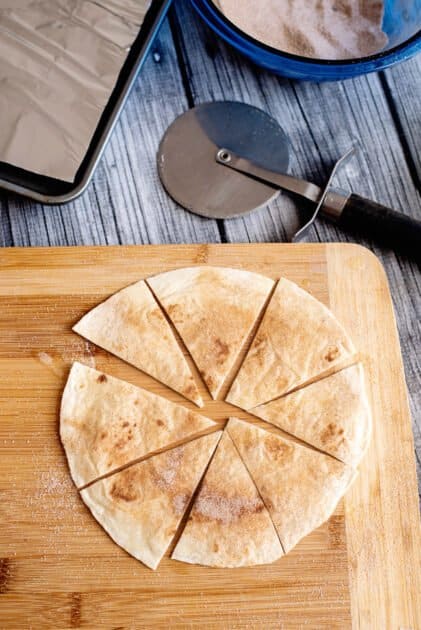 Slice tortilla into wedges with pizza cutter.