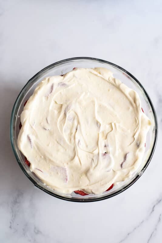 cover punch bowl cake with the last layer of pudding mixture.