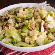 Fried cabbage with bacon in large serving bowl