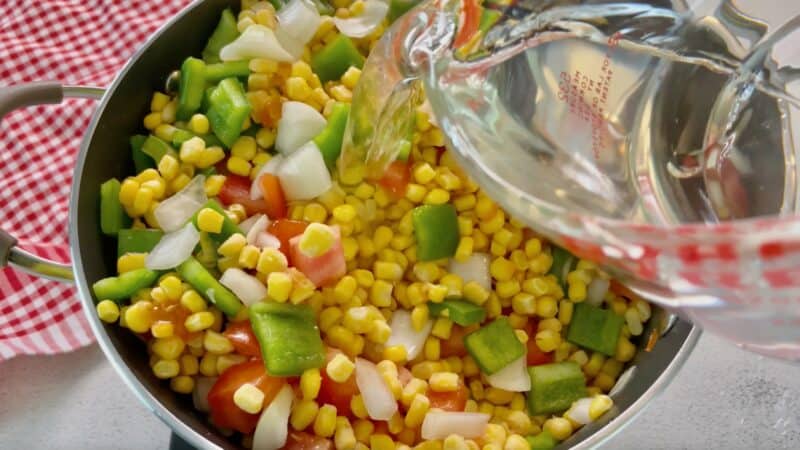add your corn, water and stir it up