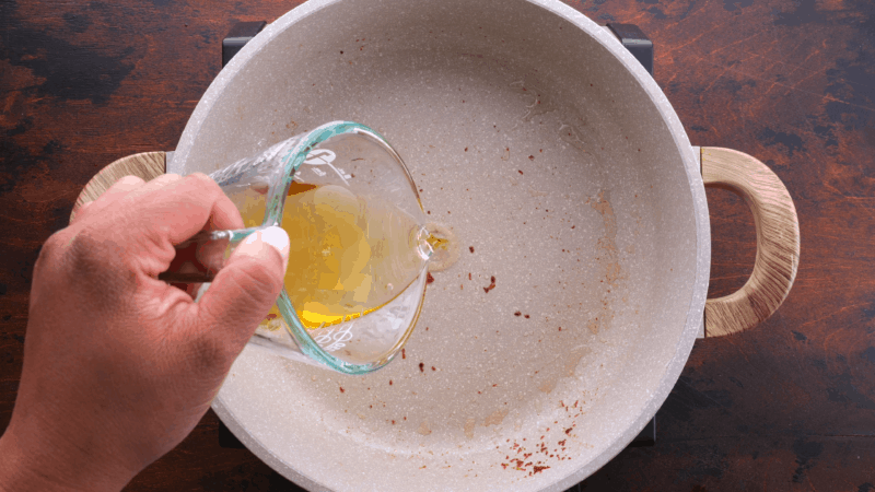 Pouring oil into skillet