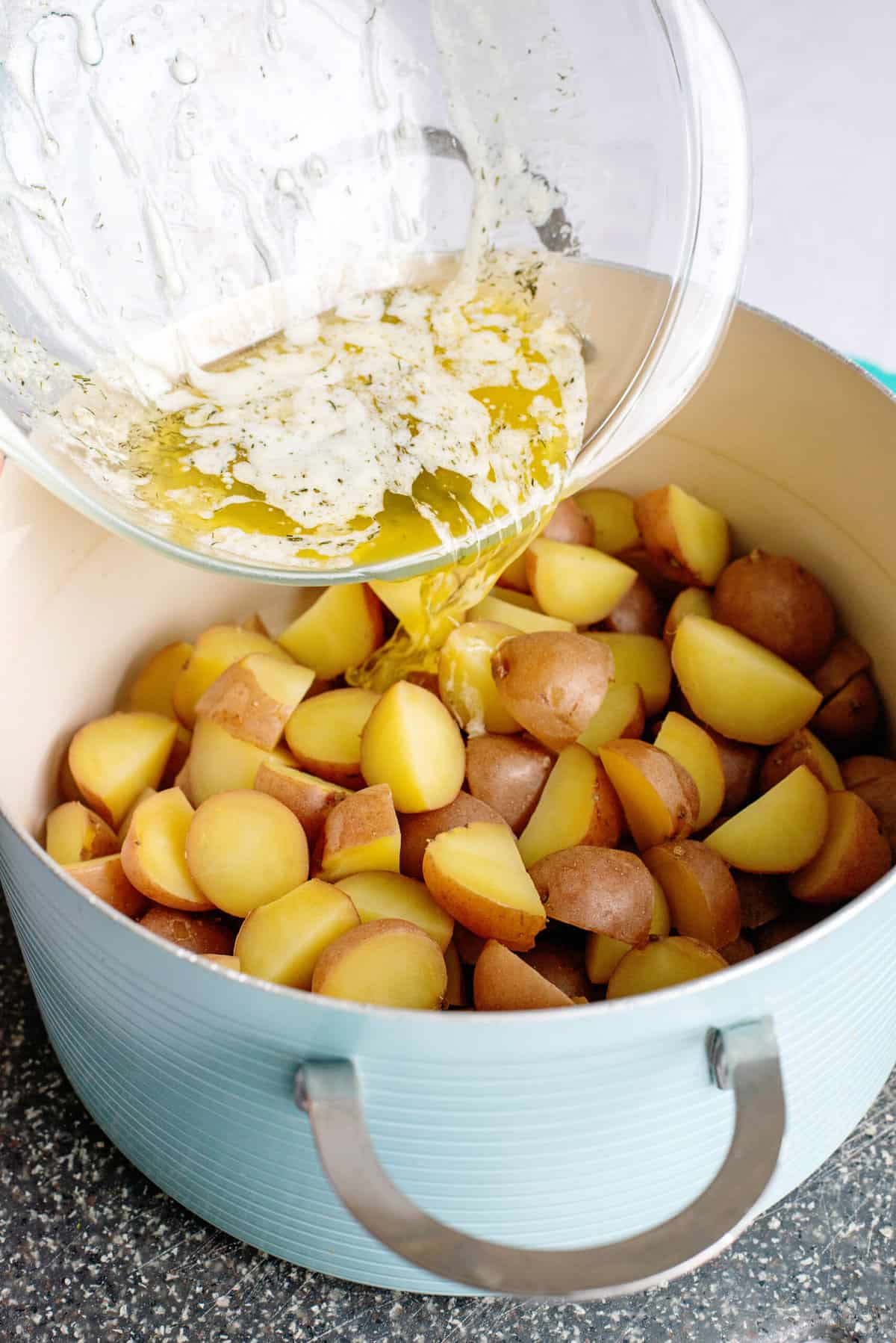 pour butter over potatoes