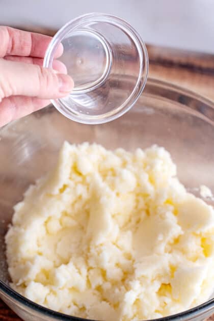 Add lemon extract to mixing bowl.