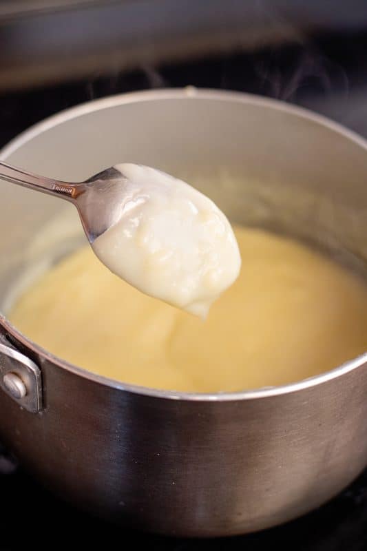 the custard should stick to the spoon when ready