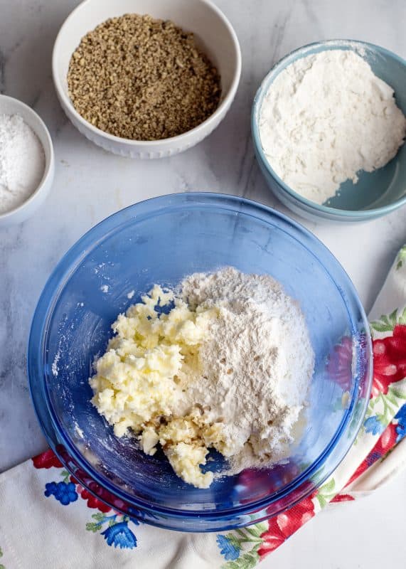 Add flour to creamed ingredients.