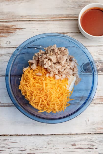Add cheese and chicken to the same bowl.