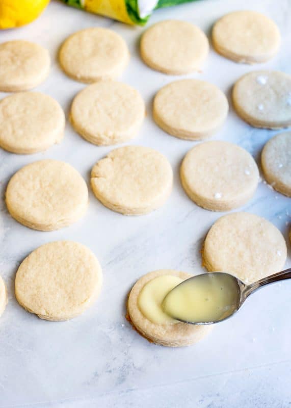 Add glaze to center of each lemon cookie.