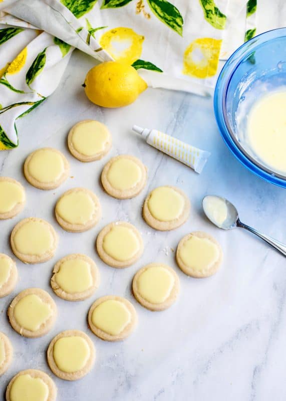 Let glazed lemon cookies dry for an hour before stacking.