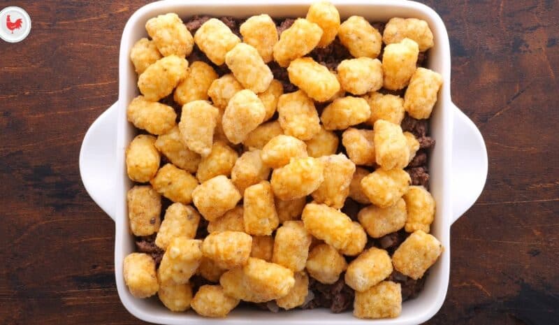 Cover casserole in the frozen tater tots.