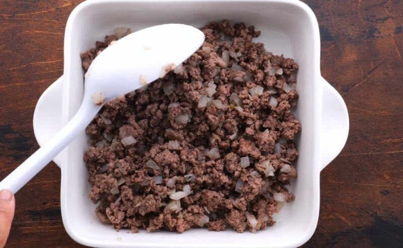 Place beef mixture at the bottom of a casserole dish.