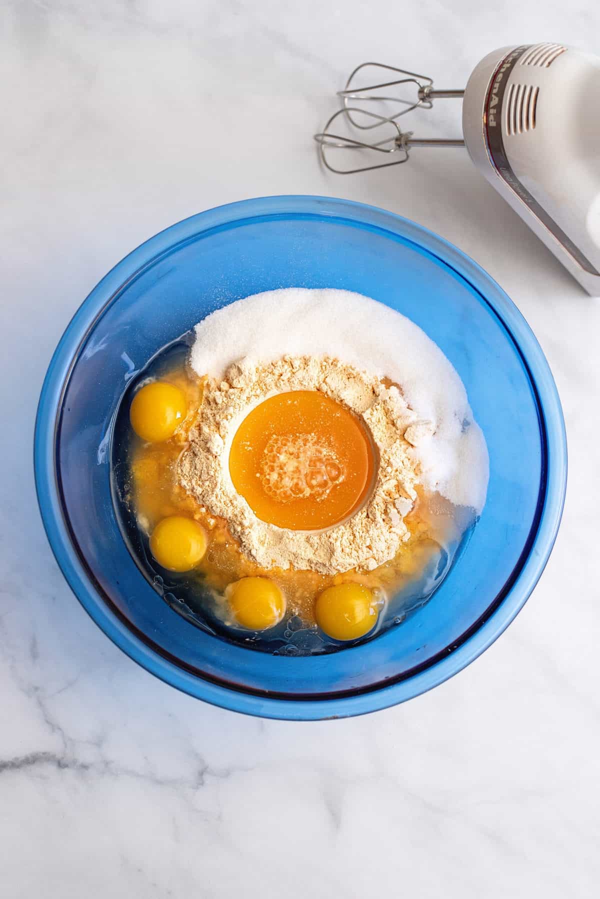 cake mix, apricot nectar, oil, sugar, and eggs in a mixing bowl