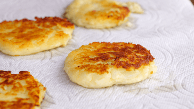 Remove potato cakes to paper towel-lined plate.