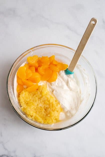 Add mandarin oranges and pineapple chunks.
