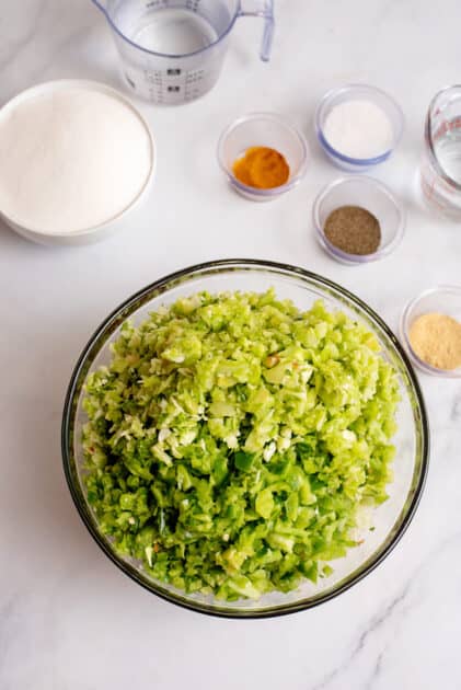 Finely chop veggies using food processor.