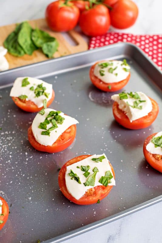 Baked tomatoes with mozzarella and basil (summer recipe idea).