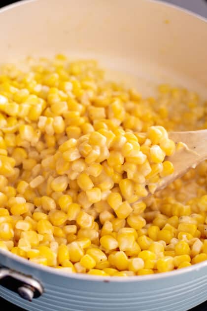 Stir together corn and butter until thawed.