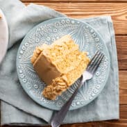 Slice of peanut butter cake with peanut butter frosting.