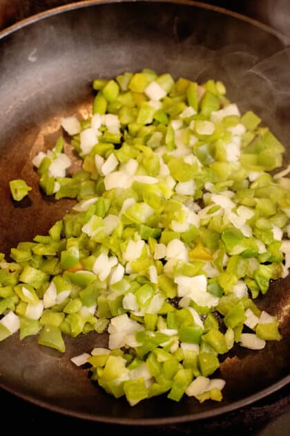 sautéing the veggies in a pan
