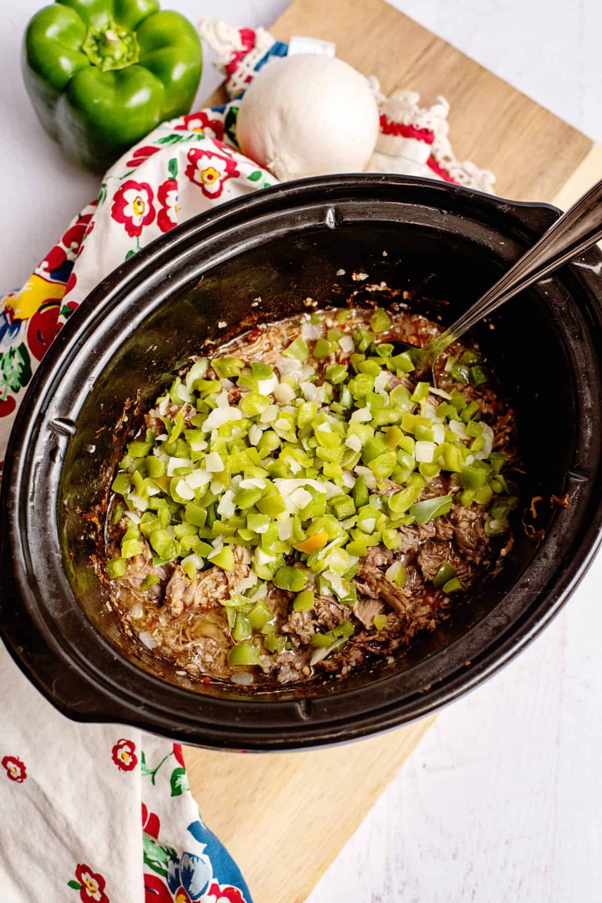 add veggies to beef in the crock pot