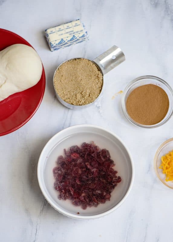 Plump up dried cranberries in water.