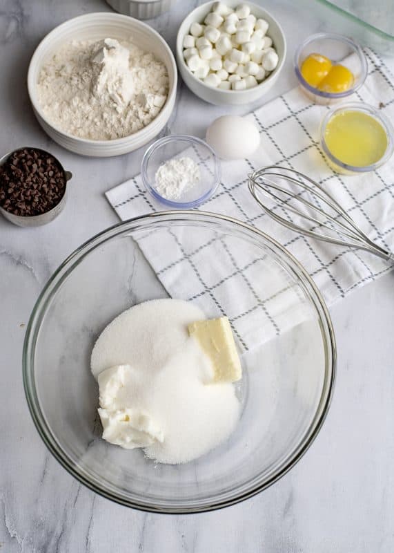 Beat butter, shortening, and sugar together in mixing bowl.