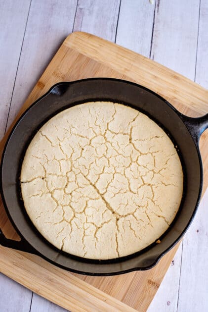Baked cornbread layer in a skillet