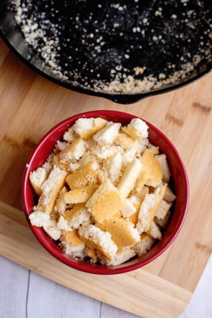 chop baked cornbread cubes in a bowl