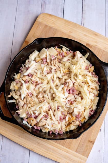 Cornbread cubes topped with turkey, ham, and cheese