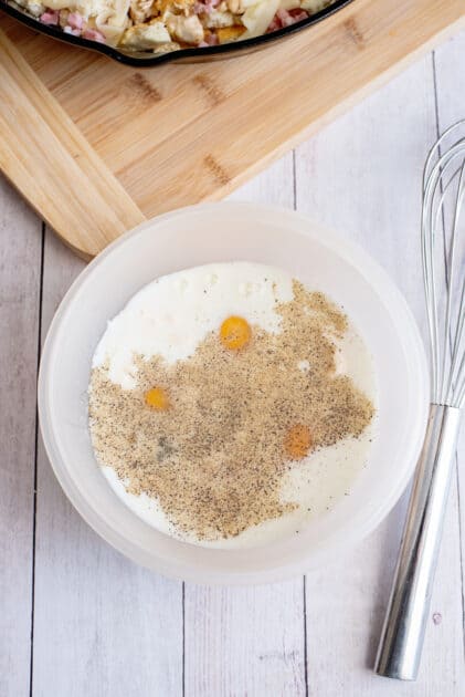 Eggs, milk, mayonnaise, mustard, salt, and pepper in a small bowl