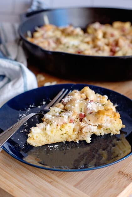 A slice of Monte Cristo Skillet with powdered sugar
