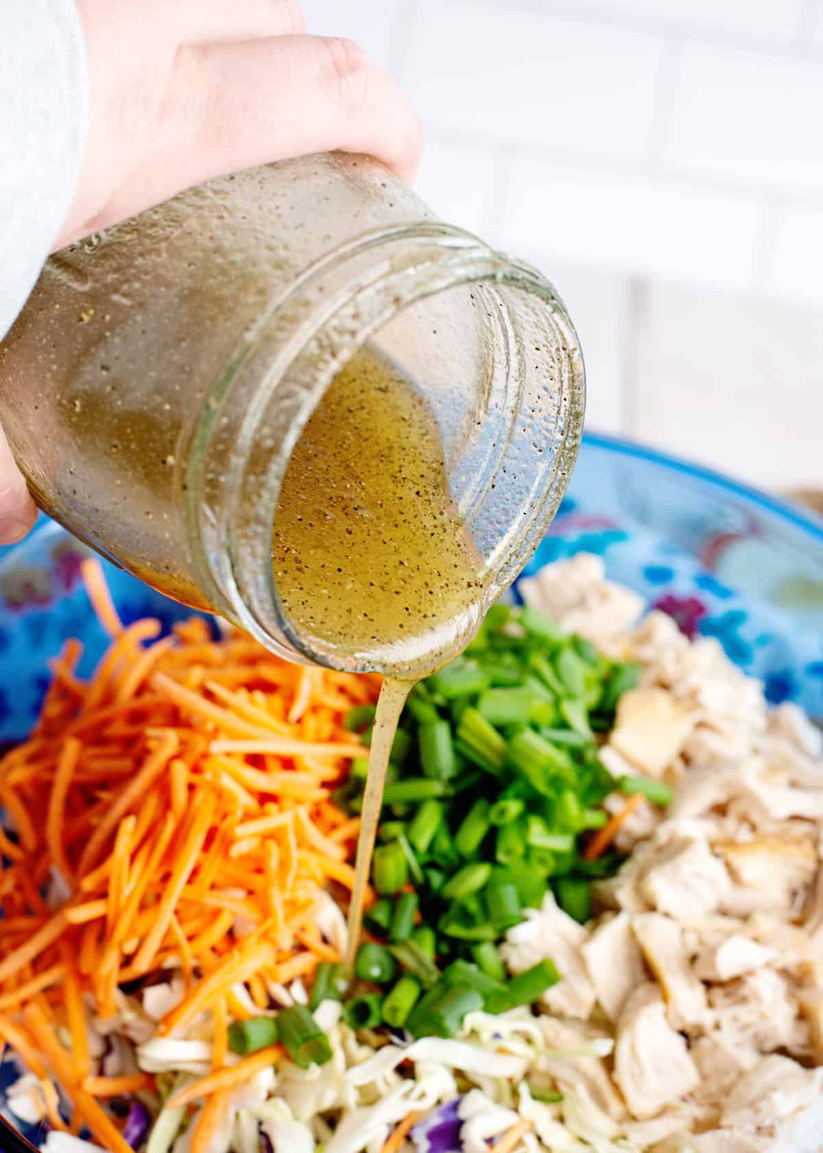 pour dressing over Chinese chicken salad