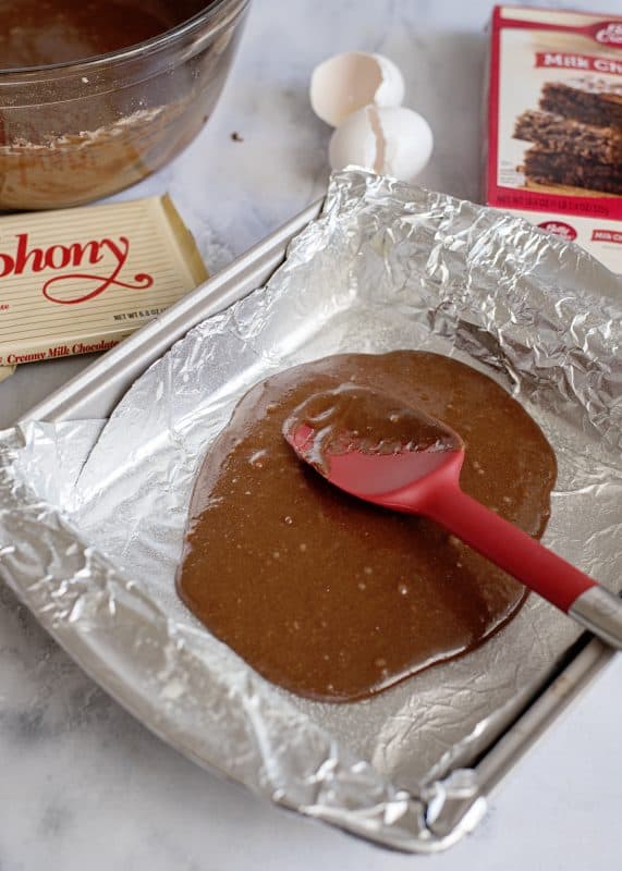 Spread half of the batter into the bottom of your baking dish.