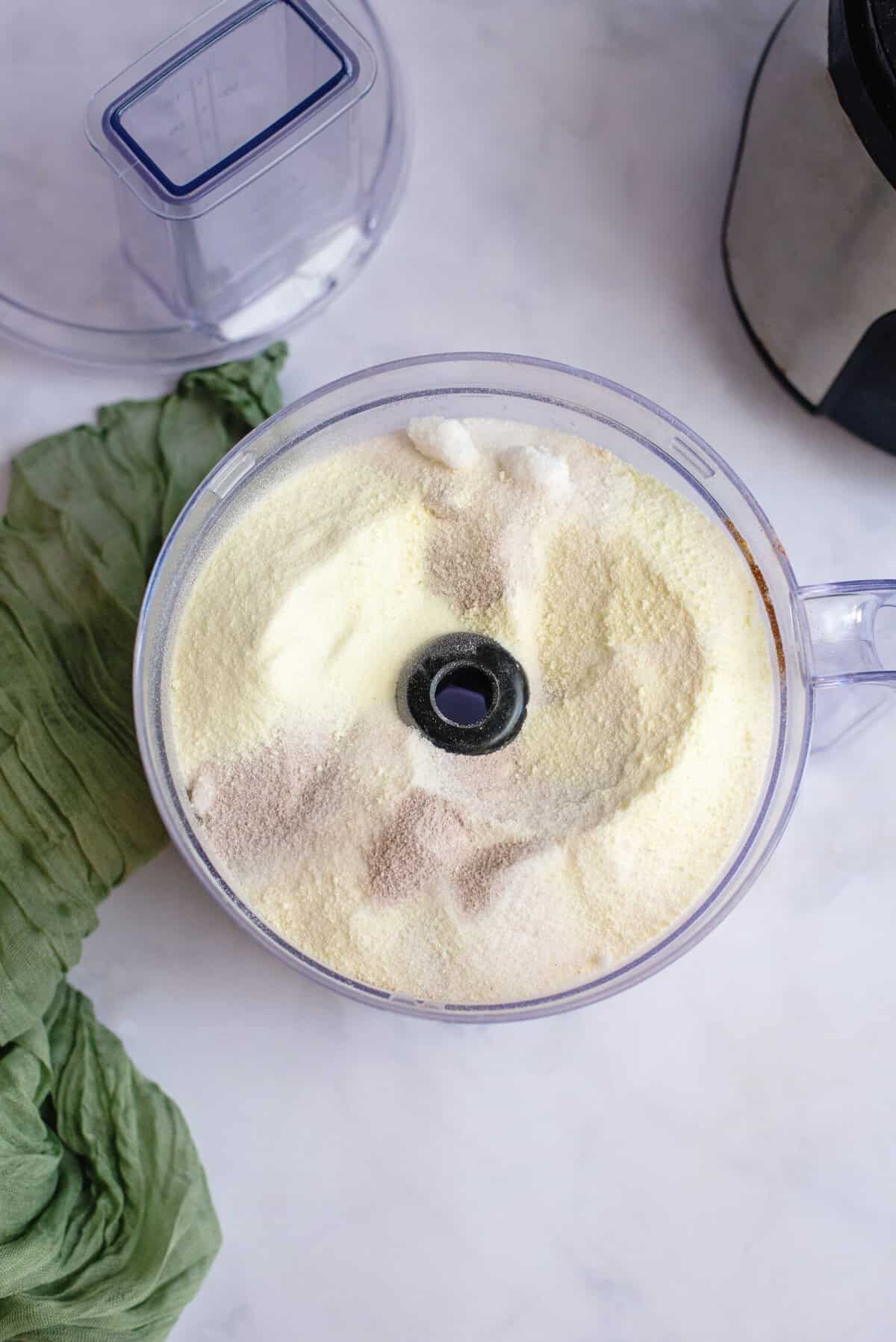 Vanilla chai mix ingredients in a food processor.