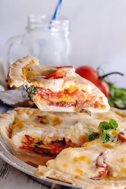 Looking inside a slice of Southern tomato pie (summer recipes).